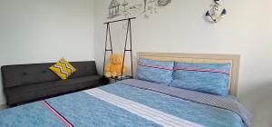Postel nebo postele na pokoji v ubytování Yu Hai B&B