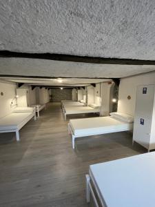 Posteľ alebo postele v izbe v ubytovaní HOSTEL PORTON