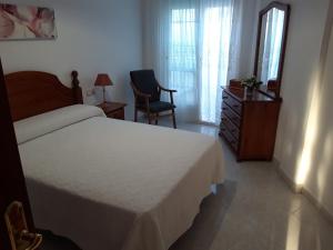 Posteľ alebo postele v izbe v ubytovaní ChavesB Apartamento en Vilaxoan de Arousa