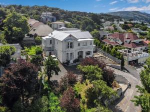 an aerial view of a large white house at Work Stay at 123 in Dunedin