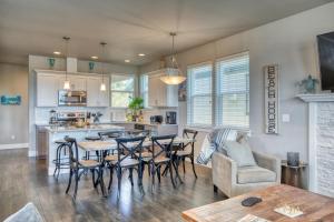 a kitchen and living room with a table and chairs at Baby Shark Villa in Ocean Shores