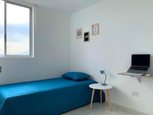 A bed or beds in a room at Espectacular apartamento completo en Pereira