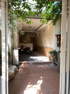 an empty hallway of a house with a motorcycle in it at Căn hộ tầng 4 thang bộ đầy đủ tiện nghi, giá rẻ in Hanoi