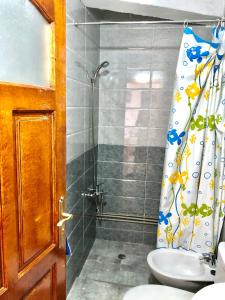 a bathroom with a shower and a sink at moderno apartamento en el centro , a 3 min del mar I in Asilah +13 photos