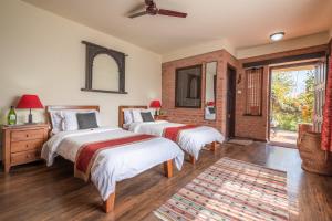 Letto o letti in una camera di Shivapuri Heights Cottage