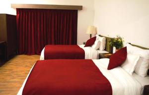 Ένα ή περισσότερα κρεβάτια σε δωμάτιο στο The Sultan Resort