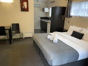 Postel nebo postele na pokoji v ubytování Anchor Lodge Motel