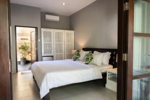 Tempat tidur dalam kamar di Manta Dive Gili Trawangan Resort