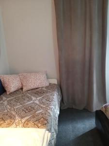 A bed or beds in a room at Quiet 1 bed house with kitchen Viana do Castelo