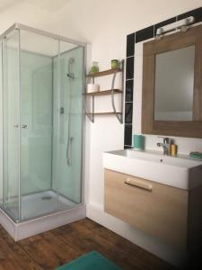 a bathroom with a glass shower and a sink at Chambres d'hôtes Ecole Buissonnière en Dordogne in Le Buisson de Cadouin +26 photos