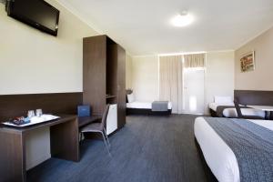 Postel nebo postele na pokoji v ubytování Links Hotel
