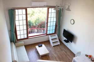 Μια τηλεόραση ή/και κέντρο ψυχαγωγίας στο Dreaming Forest Pension Seogwipo