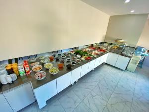 an overhead view of a buffet line of food at İskele Otel in Tasucu