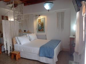 Postel nebo postele na pokoji v ubytování Harmonic Place Loutraki