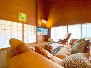 a large living room with couches and a table at YOUAN - Vacation STAY 36473v in Oishi