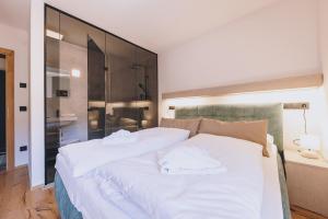 Łóżko lub łóżka w pokoju w obiekcie Premium Apartments Areit by we rent, SUMMERCARD INCLUDED