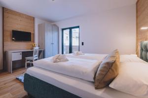 Łóżko lub łóżka w pokoju w obiekcie Premium Apartments Areit by we rent, SUMMERCARD INCLUDED