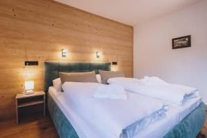 Łóżko lub łóżka w pokoju w obiekcie Premium Apartments Areit by we rent, SUMMERCARD INCLUDED