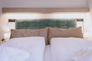 Łóżko lub łóżka w pokoju w obiekcie Premium Apartments Areit by we rent, SUMMERCARD INCLUDED
