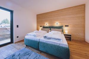 Łóżko lub łóżka w pokoju w obiekcie Premium Apartments Areit by we rent, SUMMERCARD INCLUDED