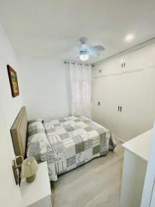 Posteľ alebo postele v izbe v ubytovaní Ecclesia Major Apartment - Vivienda con Fines Turísticos Catedral de Jaen