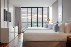 Giường trong phòng chung tại Sel de Mer Hotel & Suites