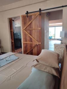 A bed or beds in a room at Lux Apartment