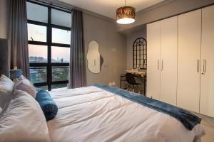 Ένα ή περισσότερα κρεβάτια σε δωμάτιο στο 2 Sleeper Stylish Sanctuary