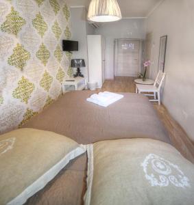 A bed or beds in a room at Sweet Home Faleria