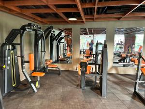a gym with lots of tread machines and people in the background at Grand Residences Cebu ETB - Near IT Park and Ayala Cebu in Cebu City