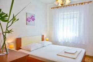 Postel nebo postele na pokoji v ubytování Holiday Apartments Soparin