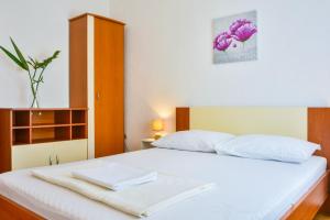 Postel nebo postele na pokoji v ubytování Holiday Apartments Soparin