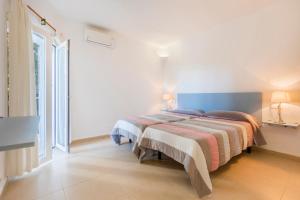 Łóżko lub łóżka w pokoju w obiekcie Villa Mar Gran