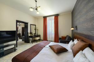 Postel nebo postele na pokoji v ubytování Hotel Aurum
