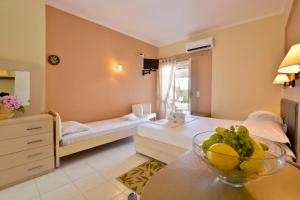 A bed or beds in a room at Xristina