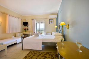 A bed or beds in a room at Xristina