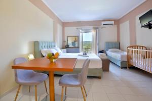 A bed or beds in a room at Xristina