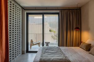A bed or beds in a room at The Newel Psychiko