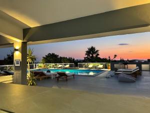 a house with a swimming pool on a roof at Dela in Hvar