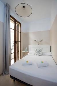 A bed or beds in a room at Mesones 54