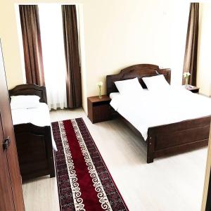 Postel nebo postele na pokoji v ubytování Nomad Hotel