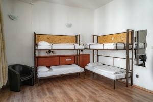 Postel nebo postele na pokoji v ubytování Equity Point Budapest