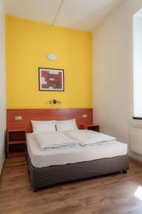 Postel nebo postele na pokoji v ubytování Equity Point Budapest