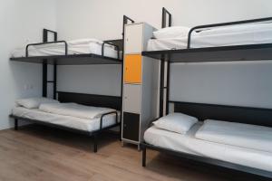 Postel nebo postele na pokoji v ubytování Equity Point Budapest