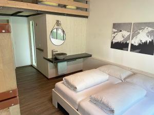 Кровать или кровати в номере Hotel GO-IN