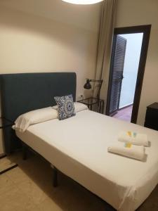 A bed or beds in a room at Mesones 54