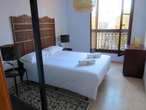 A bed or beds in a room at Mesones 54