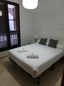 A bed or beds in a room at Mesones 54