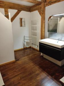 a bathroom with a sink and a mirror at ferme du bois joli in Marigny +42 photos