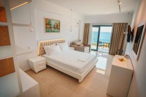 A bed or beds in a room at Ionion Beach Resort